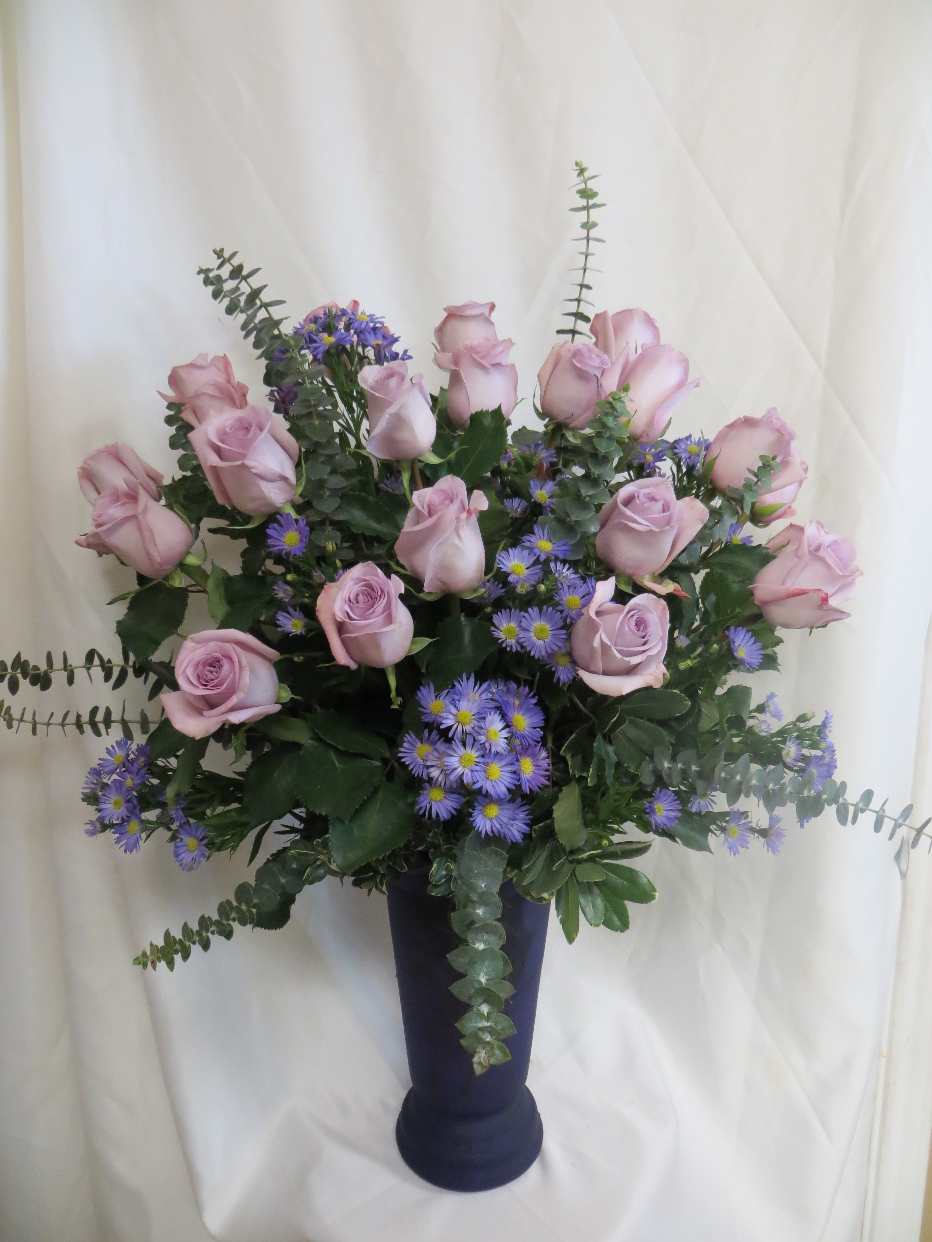 beautiful bouquet of two dozen purple roses for houston delivery 